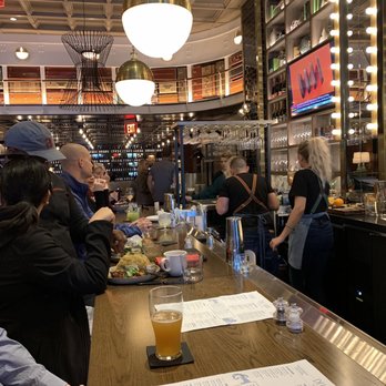 SoCal Kitchen + Bar - Bar Area. Stacked Suitcases in upper interior give it a really cool look. - New American Near Me - Columbus, Ohio SoCal Kitchen + Bar - Bar Area. Stacked Suitcases in upper interior give it a really cool look. - New American Near Me - Columbus, Ohio