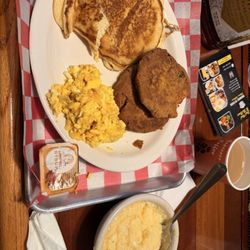 Soul Food To The Bone - Salmon croquettes, grits, eggs, and pancakes