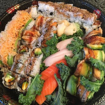Sushi Aji - Five different rolls, two types of super fresh sushi, all presented on a gorgeous platter (nice surprise!) from Sushi Aji - Japanese Near Me - Lafayette, Colorado