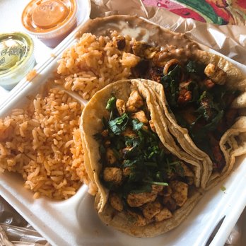 Taqueria Puebla - 2 taco lunch special to go. Had a little slide issue in the car so it shifted a little ... chicken and pastor tacos, no onion. - Mexican Near Me - Indianapolis, Indiana