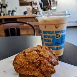 a muffin and a cup of coffee