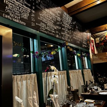 Mamou - a menu on the wall of a restaurant - Brasseries Near Me - New Orleans, Louisiana