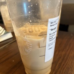 a plastic cup with a drink in it