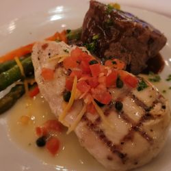 Strawberry Farms Golf Club - Yummy dual entrée of steak and chicken. Cut the beef open first. Mine was bloody pink.