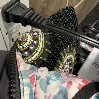 Planet Fitness - Screenshot from video of the plug just falling right out of the outlet. Propped with my bag. - Trainers Near Me - Burbank, California