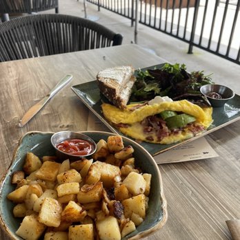 First Watch - Bacon omelette with a side of potatoes and greens - Breakfast & Brunch Near Me - Cedar Park, Texas