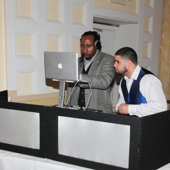 DOC-ROB Entertainment - CEO DJ DOC-ROB consulting with groom on the big day. - Videographers Near Me DOC-ROB Entertainment - CEO DJ DOC-ROB consulting with groom on the big day. - Videographers Near Me