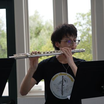Kennedy Flute Studio - Student playing alto flute at one of the 2025 Flute Choir Summer Camp Showcase Concerts put on by Kennedy Flute Studio. - Private Tutors Near Me