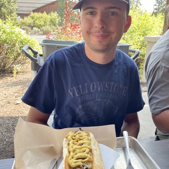 Bangers & Brews - Westside - My son enjoying a German Bratwurst. - German Near Me - Bend, Oregon