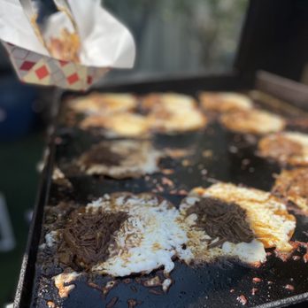Wet Tacos - a person cooking food on a grill - Tacos Near Me - San Diego, California Wet Tacos - a person cooking food on a grill - Tacos Near Me - San Diego, California