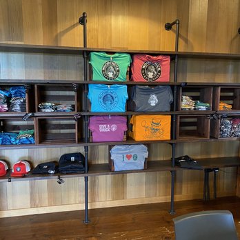 Woodchuck Hard Cidery - shelves with t - shirts on them - Cideries Near Me - Middlebury, Vermont Woodchuck Hard Cidery - shelves with t - shirts on them - Cideries Near Me - Middlebury, Vermont