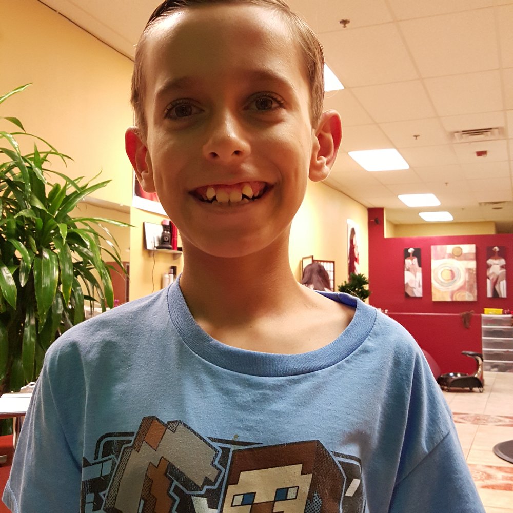 Happy Cuts - After his "trim" and his hair now has to be brush to the side like that because it will look lopsided if not - Hair Salons Near Me - Roseville, California Happy Cuts - After his "trim" and his hair now has to be brush to the side like that because it will look lopsided if not - Hair Salons Near Me - Roseville, California
