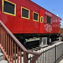 Tomball Railroad Depot Plaza - Tomball and Walden railway caboose from the outside