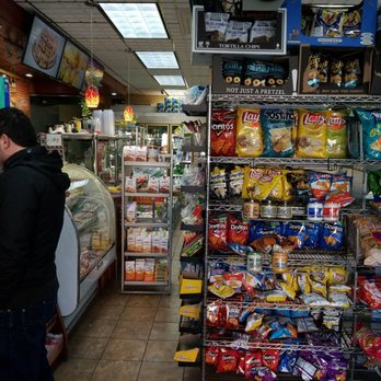 Lunch Stop Deli - a man standing in front of the counter - Delis Near Me - Astoria, New York Lunch Stop Deli - a man standing in front of the counter - Delis Near Me - Astoria, New York