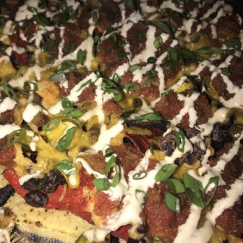 Pies & Pints - Pork & Pepper Nachos Slow roasted pulled pork Seasoned black beans Jalapeños Cheddar cheese Salsa Scallions Chipotle crema - Pizza Near Me - Birmingham, Alabama Pies & Pints - Pork & Pepper Nachos Slow roasted pulled pork Seasoned black beans Jalapeños Cheddar cheese Salsa Scallions Chipotle crema - Pizza Near Me - Birmingham, Alabama