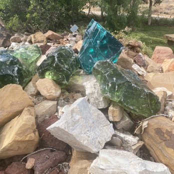 Zion Rock & Gem - closer picture of the large rocks outside, the blue and green are large glass chunks. - Gift Shops Near Me - Springdale, Utah Zion Rock & Gem - closer picture of the large rocks outside, the blue and green are large glass chunks. - Gift Shops Near Me - Springdale, Utah