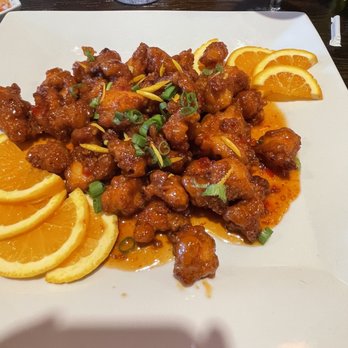 Thai Station Restaurant - Plate of orange chicken with orange slices. Very delicious and highly recommended - Thai Near Me - Indianapolis, Indiana