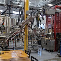 Pigeon Hill Brewing Company - The back room has all the brewery equipment, plus merch, darts, and more tables