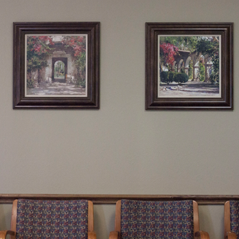 YourFamilyDoc - Two paintings of a garden hang on the wall above the waiting room chairs. - Family Practice Near Me - Arlington, Texas