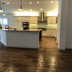 Larrys Quality Home Repair Services - New tile plank floors. 3,300 sq ft