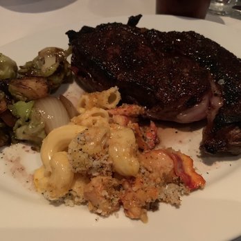 Mitchell's Ocean Club - 16oz ribeye with scoops of the family-style served Brussels sprouts and lobster mac-n-cheese - Steakhouses Near Me - Columbus, Ohio Mitchell's Ocean Club - 16oz ribeye with scoops of the family-style served Brussels sprouts and lobster mac-n-cheese - Steakhouses Near Me - Columbus, Ohio