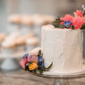 Honey Bee Pastries - a white cake with flowers on top - Custom Cakes Near Me Honey Bee Pastries - a white cake with flowers on top - Custom Cakes Near Me