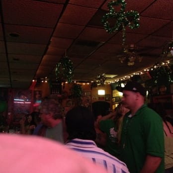 Suzy's Bar - a man in a green shirt - Dive Bars Near Me - Hamtramck, Michigan