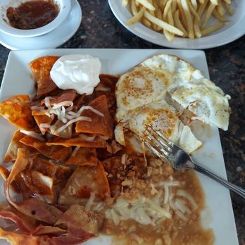 Sazon It Mexican Grill - Chilaquiles en salsa Roja, huevos al gusto, tocino y frijolitos. Postre muy delicioso. - New Mexican Cuisine Near Me - Rialto, California Sazon It Mexican Grill - Chilaquiles en salsa Roja, huevos al gusto, tocino y frijolitos. Postre muy delicioso. - New Mexican Cuisine Near Me - Rialto, California