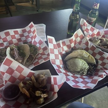 Black Monk Tavern - Left to right- bacon wrapped shrimp app, blackened shrimp tacos, trashcan tacos, Cajun tots. - Dive Bars Near Me - Corpus Christi, Texas
