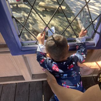 Magical Bridge Playground - Elijah looking down from top window of castle - Parks Near Me - Sunnyvale, California Magical Bridge Playground - Elijah looking down from top window of castle - Parks Near Me - Sunnyvale, California