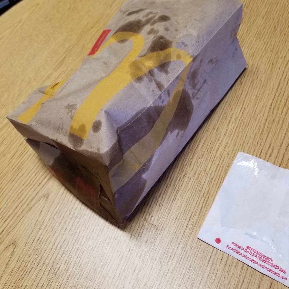 McDonald's - a brown paper bag on a table - Fast Food Near Me - Alliance, Nebraska