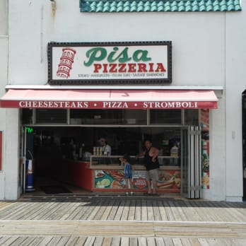 Pisa Pizza - a woman walking past a pizza shop - Pizza Near Me - Ocean City, New Jersey Pisa Pizza - a woman walking past a pizza shop - Pizza Near Me - Ocean City, New Jersey
