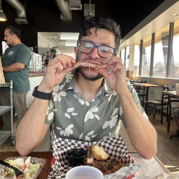 Rosie's BBQ Kitchen - Enjoying his rib.. - Barbeque Near Me - Chatsworth, California Rosie's BBQ Kitchen - Enjoying his rib.. - Barbeque Near Me - Chatsworth, California