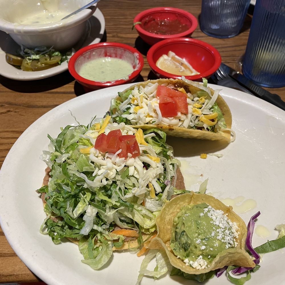 Jimmy Changas - 1st plate of Jimmy's Deluxe meal: Beef taco, bean tostada, guacamole (missing from photo-very large chip with queso on it) - Mexican Near Me - League City, Texas Jimmy Changas - 1st plate of Jimmy's Deluxe meal: Beef taco, bean tostada, guacamole (missing from photo-very large chip with queso on it) - Mexican Near Me - League City, Texas
