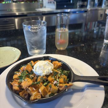 Busboys and Poets - Sweet Potato Hash* with poached egg. See other picture for the egg overcooked. - Breakfast & Brunch Near Me - Washington, DC, District of Columbia Busboys and Poets - Sweet Potato Hash* with poached egg. See other picture for the egg overcooked. - Breakfast & Brunch Near Me - Washington, DC, District of Columbia