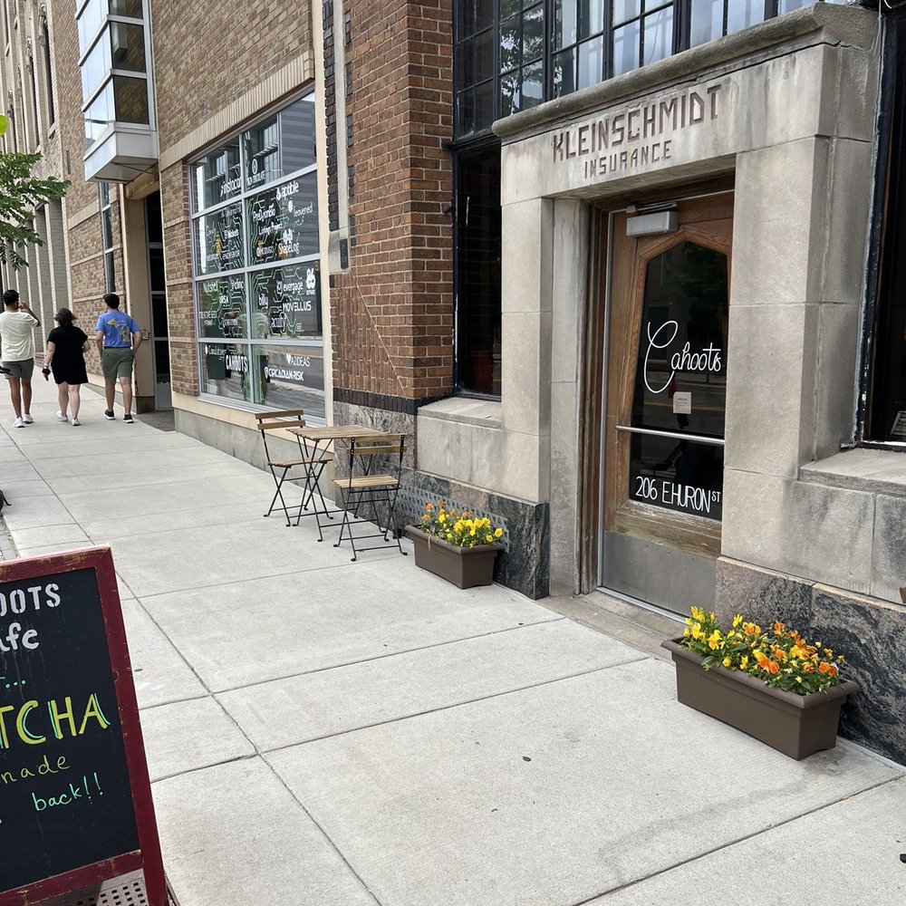 Cahoots Cafe - Front entrance with a couple outdoor tables - Coffee & Tea Near Me - Ann Arbor, Michigan