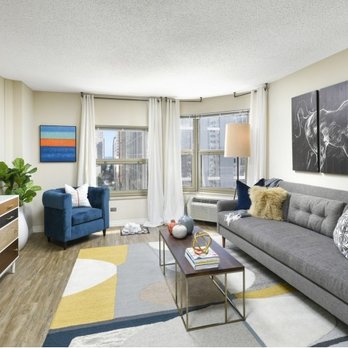 Chestnut Place Apartments - Renovated living room with plank flooring. - Apartments Near Me - Chicago, Illinois Chestnut Place Apartments - Renovated living room with plank flooring. - Apartments Near Me - Chicago, Illinois