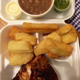 1/4 chicken dark with two sides, beans and yuca.