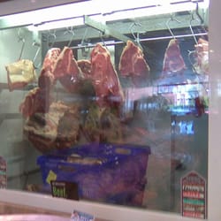 Dry aging beef hanging in Ennis Butchers