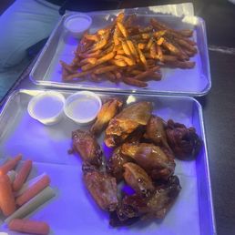 Garlic Buffalo Fries and mango habanero wings Garlic Buffalo Fries and mango habanero wings