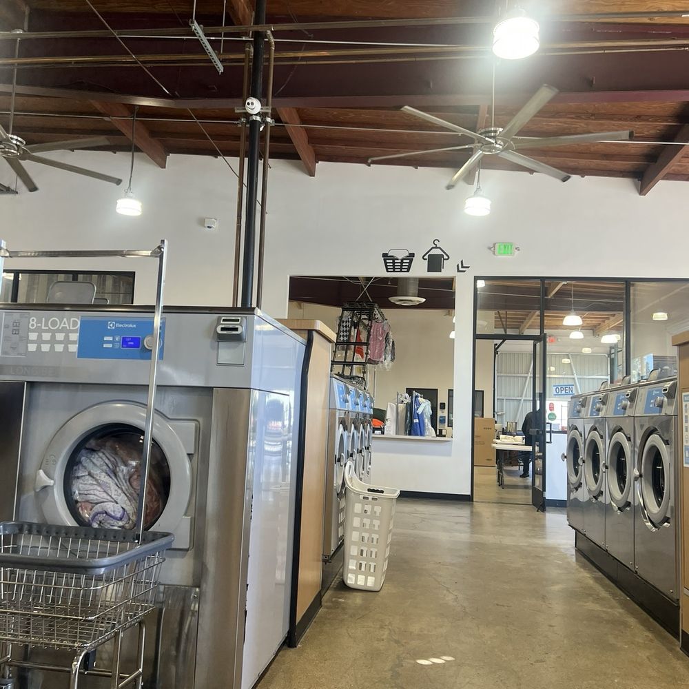 Lucy's Laundry - A view of the back area where they provide dry cleaning and fluff & fold. - Laundromat Near Me - Costa Mesa, California Lucy's Laundry - A view of the back area where they provide dry cleaning and fluff & fold. - Laundromat Near Me - Costa Mesa, California