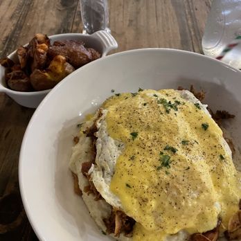 Mason & Dixie - Souther Benedict over grits with a side of amazing taters.  Just lovely. - Southern Near Me - Grapevine, Texas