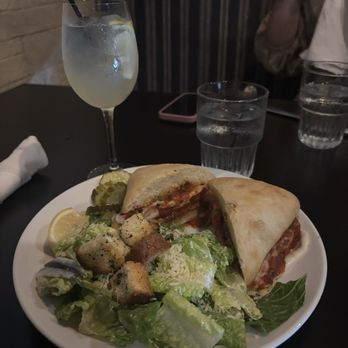 Tuscan Table - Chicken Parmesan Sandwich with side Cesar salad and a white sangria drink. - Italian Near Me - South Portland, Maine Tuscan Table - Chicken Parmesan Sandwich with side Cesar salad and a white sangria drink. - Italian Near Me - South Portland, Maine