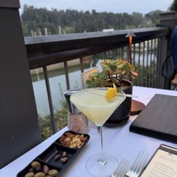 Thyme martini and complementary nuts and olives Thyme martini and complementary nuts and olives