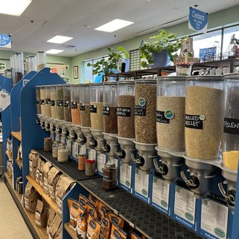 Blue Market AK - Some of the drop-down dry goods displayed with sourcing information. Local flours and baking mixes line the shelves beneath them. - Grocery Near Me - Anchorage, Alaska Blue Market AK - Some of the drop-down dry goods displayed with sourcing information. Local flours and baking mixes line the shelves beneath them. - Grocery Near Me - Anchorage, Alaska