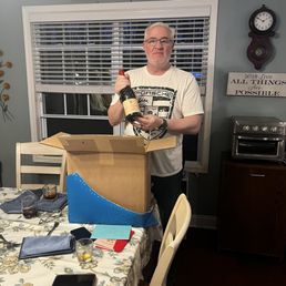 Hubby opening his wine. Hubby opening his wine.