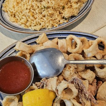 Taverna Kyclades - Bayside - Yellow Rice and Fried Calamari. - Greek Near Me - Bayside, New York Taverna Kyclades - Bayside - Yellow Rice and Fried Calamari. - Greek Near Me - Bayside, New York