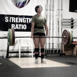 Strength Ratio - Coach Becca prepares for upcoming powerlifting meet.