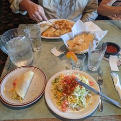 Toreros Famosos Mexican Restaurant - Chicken tostada with side order asada taco, and chicken enchilada combo plate with asada taco