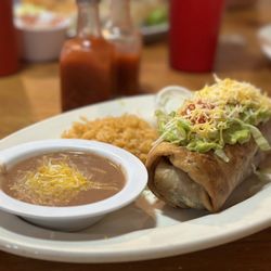 Chatitas Mexican Restaurant - Always great food and exceptional service! (Pictured: Red Chili Chimichanga | Ribeye, Baked Potato, & Garden Salad | Cutest lil' sign!